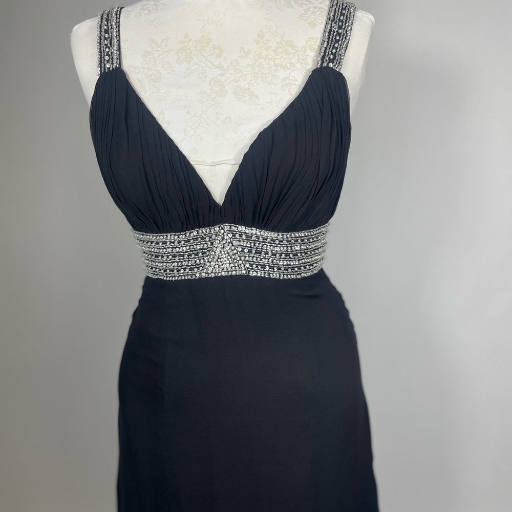 Used chiffon black dress, with beads on the waist, great condition.